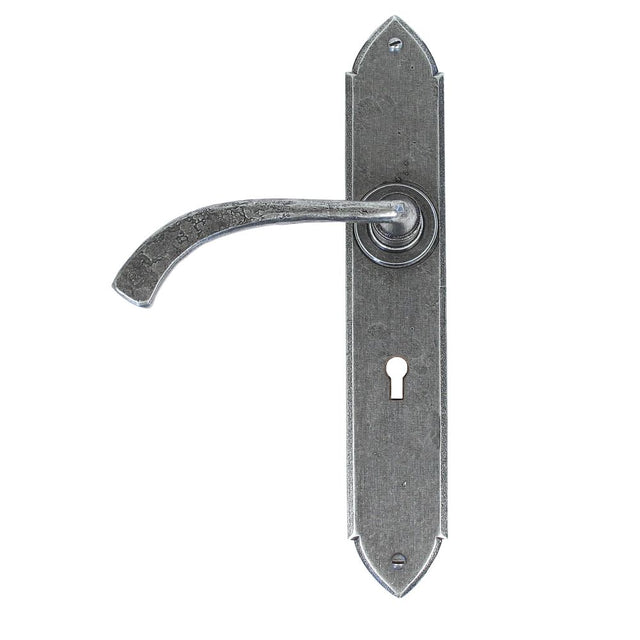 This is an image showing From The Anvil - Pewter Gothic Curved Sprung Lever Lock Set available from trade door handles, quick delivery and discounted prices