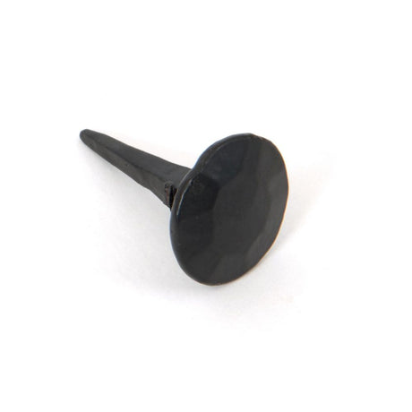 This is an image showing From The Anvil - Black 1" Handmade Nail (20mm HD DIA) available from trade door handles, quick delivery and discounted prices