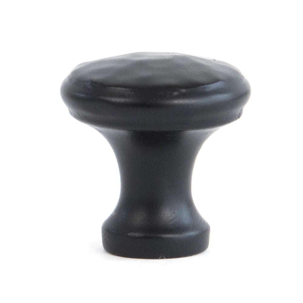 This is an image showing From The Anvil - Black Hammered Cabinet Knob - Small available from trade door handles, quick delivery and discounted prices