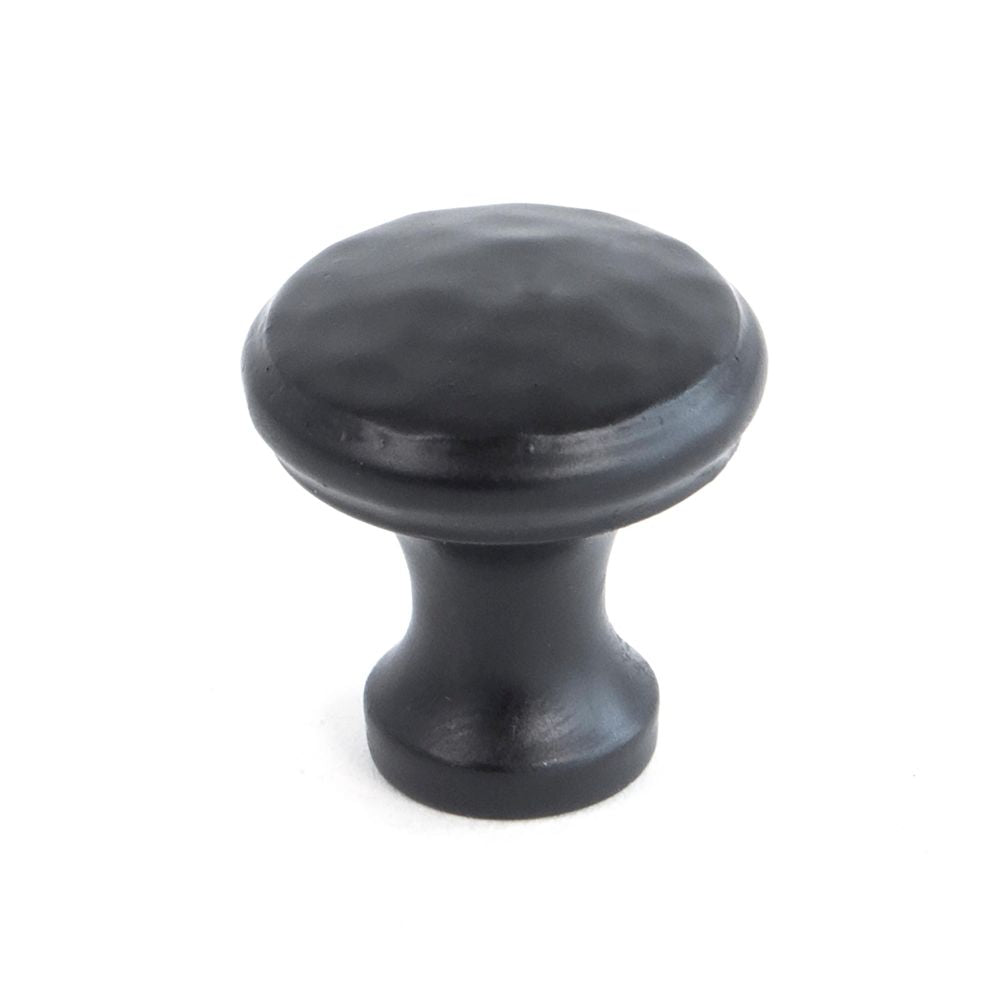 This is an image showing From The Anvil - Black Hammered Cabinet Knob - Small available from trade door handles, quick delivery and discounted prices