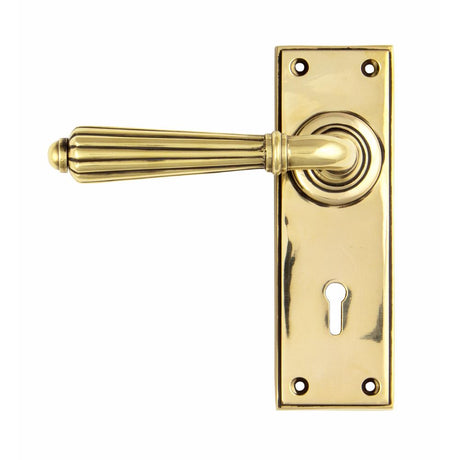 This is an image showing From The Anvil - Aged Brass Hinton Lever Lock Set available from trade door handles, quick delivery and discounted prices