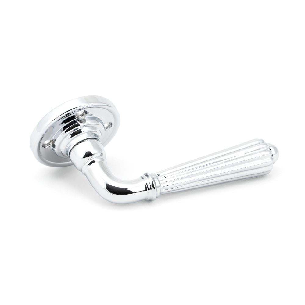 This is an image showing From The Anvil - Polished Chrome Hinton Lever on Rose Set available from trade door handles, quick delivery and discounted prices