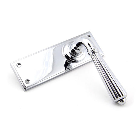 This is an image showing From The Anvil - Polished Chrome Hinton Lever Latch Set available from trade door handles, quick delivery and discounted prices