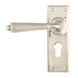 This is an image showing From The Anvil - Polished Nickel Hinton Lever Euro Lock Set available from trade door handles, quick delivery and discounted prices