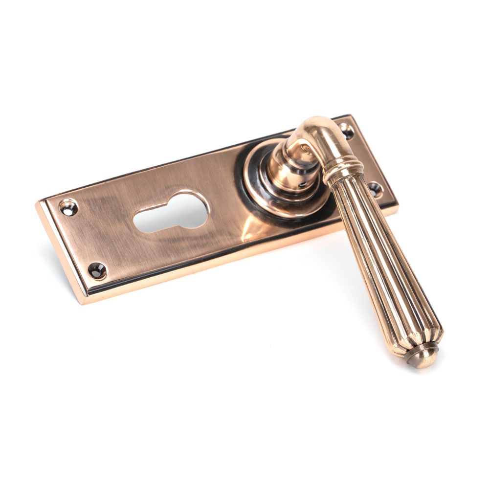 This is an image showing From The Anvil - Polished Bronze Hinton Lever Euro Lock Set available from trade door handles, quick delivery and discounted prices