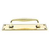 This is an image showing From The Anvil - Aged Brass 300mm Art Deco Pull Handle on Backplate available from trade door handles, quick delivery and discounted prices