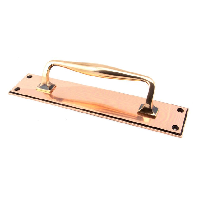 This is an image showing From The Anvil - Polished Bronze 300mm Art Deco Pull Handle on Backplate available from trade door handles, quick delivery and discounted prices