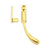 This is an image showing From The Anvil - Polished Brass Night-Vent Locking Peardrop Fastener - RH available from trade door handles, quick delivery and discounted prices