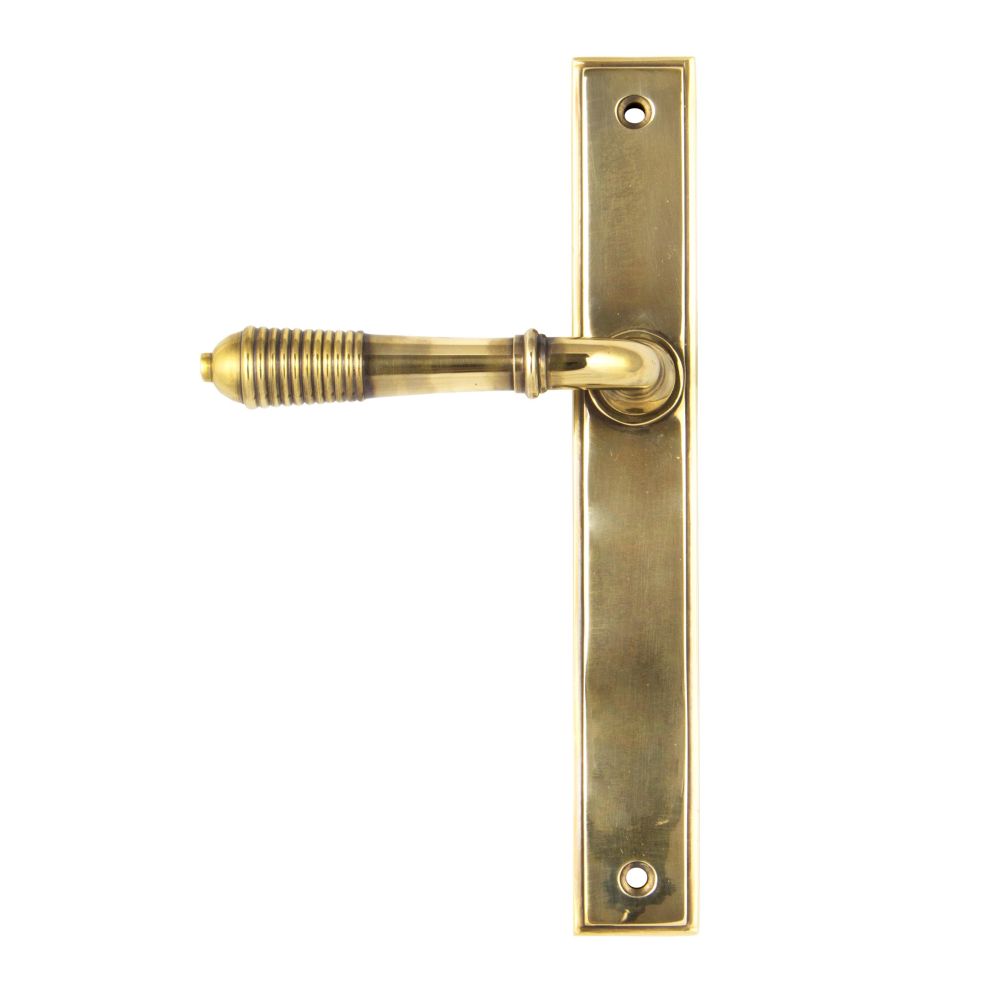 This is an image showing From The Anvil - Aged Brass Reeded Slimline Lever Latch Set available from trade door handles, quick delivery and discounted prices