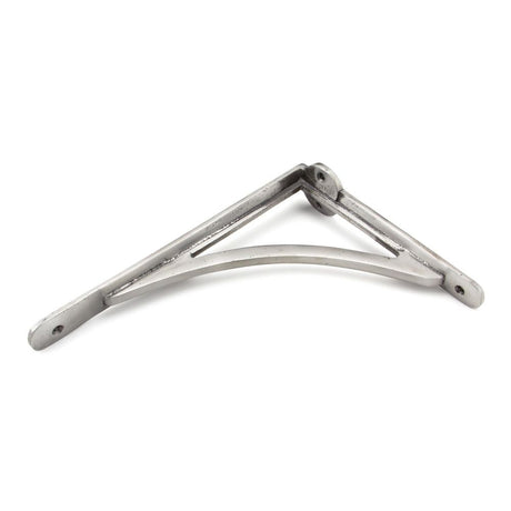 This is an image showing From The Anvil - Natural Smooth 10'' x 7'' Curved Shelf Bracket available from trade door handles, quick delivery and discounted prices