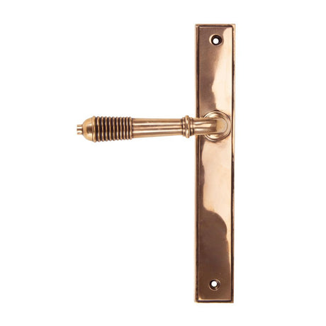 This is an image showing From The Anvil - Polished Bronze Reeded Slimline Lever Latch Set available from trade door handles, quick delivery and discounted prices