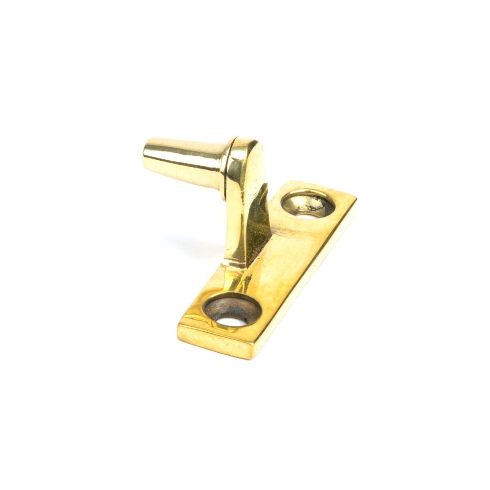 This is an image showing From The Anvil - Aged Brass Cranked Casement Stay Pin available from trade door handles, quick delivery and discounted prices