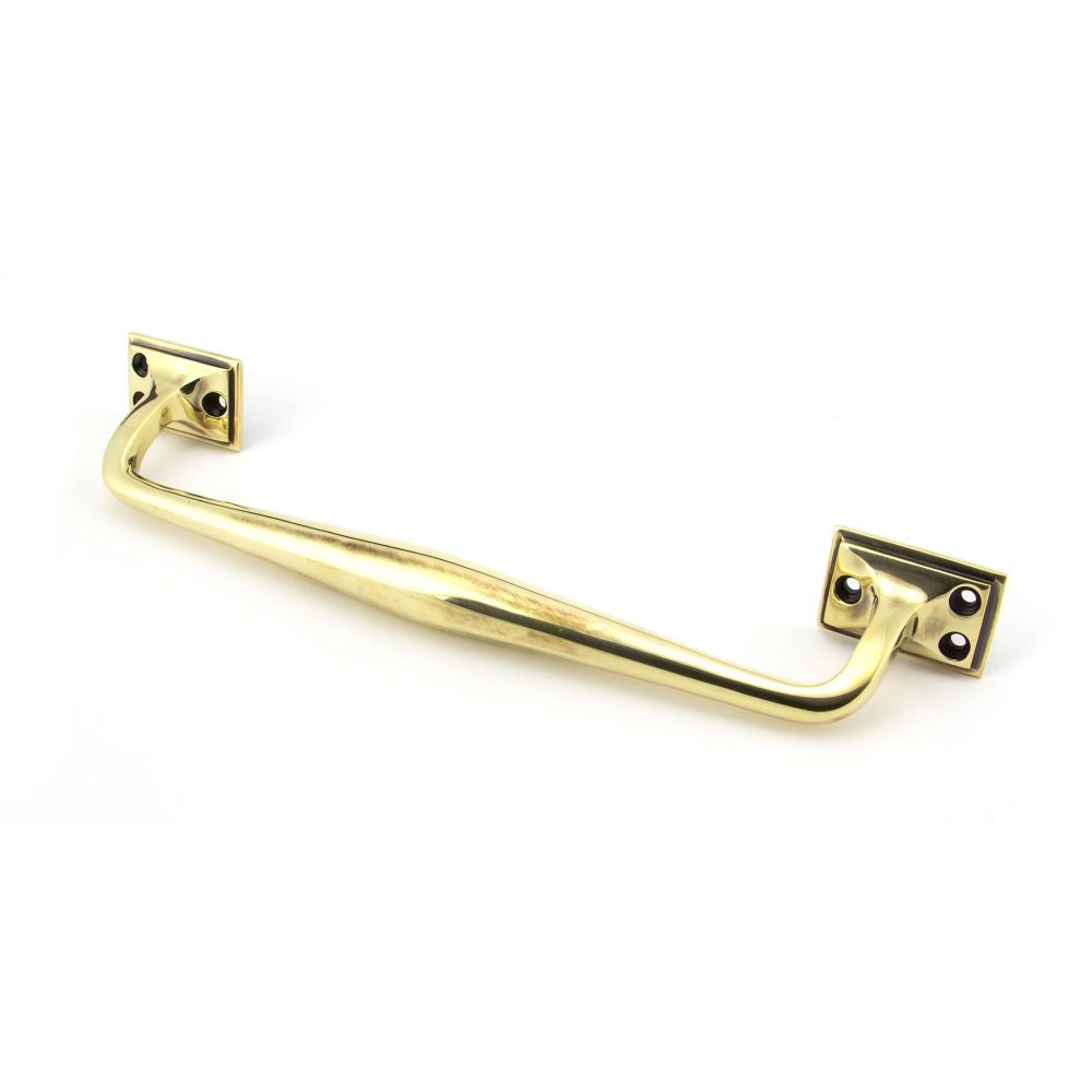 This is an image showing From The Anvil - Aged Brass 300mm Art Deco Pull Handle available from trade door handles, quick delivery and discounted prices