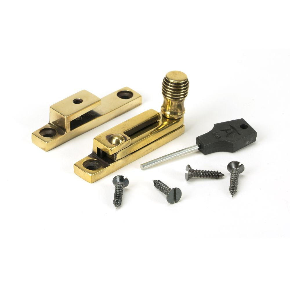 This is an image showing From The Anvil - Aged Brass Beehive Quadrant Fastener - Narrow available from trade door handles, quick delivery and discounted prices