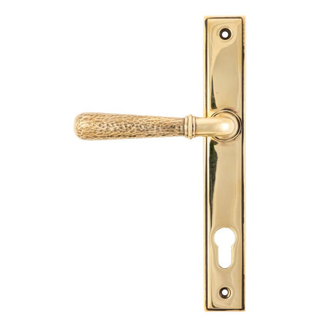 This is an image showing From The Anvil - Aged Brass Hammered Newbury Slimline Espag. Lock Set available from trade door handles, quick delivery and discounted prices