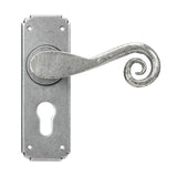 This is an image showing From The Anvil - Pewter Monkeytail Lever Euro Lock Set available from trade door handles, quick delivery and discounted prices