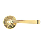 This is an image showing From The Anvil - Aged Brass Avon Round Lever on Rose Set (Art Deco) available from trade door handles, quick delivery and discounted prices