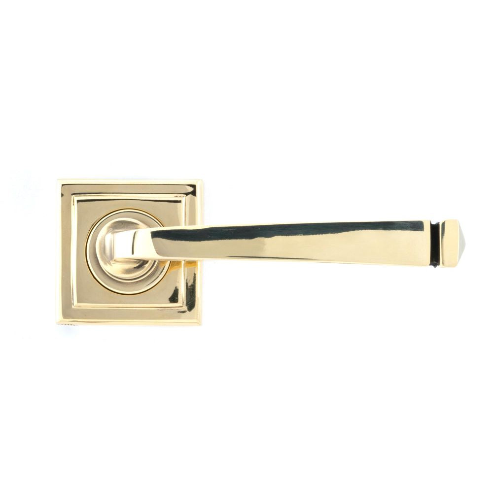 This is an image showing From The Anvil - Aged Brass Avon Round Lever on Rose Set (Square) available from trade door handles, quick delivery and discounted prices