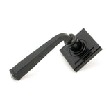 This is an image showing From The Anvil - Black Avon Round Lever on Rose Set (Square) available from trade door handles, quick delivery and discounted prices