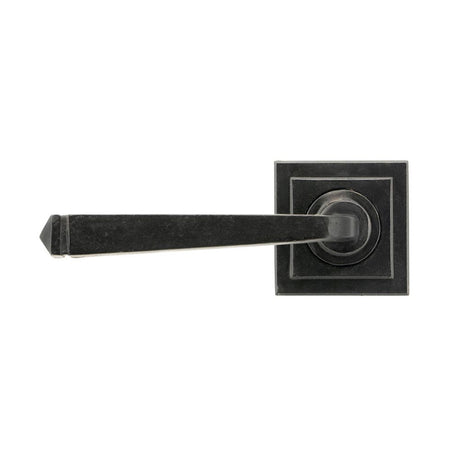 This is an image showing From The Anvil - External Beeswax Avon Round Lever on Rose Set (Square) available from trade door handles, quick delivery and discounted prices