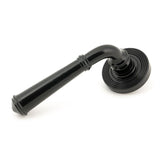 This is an image showing From The Anvil - Black Regency Lever on Rose Set (Beehive) available from trade door handles, quick delivery and discounted prices