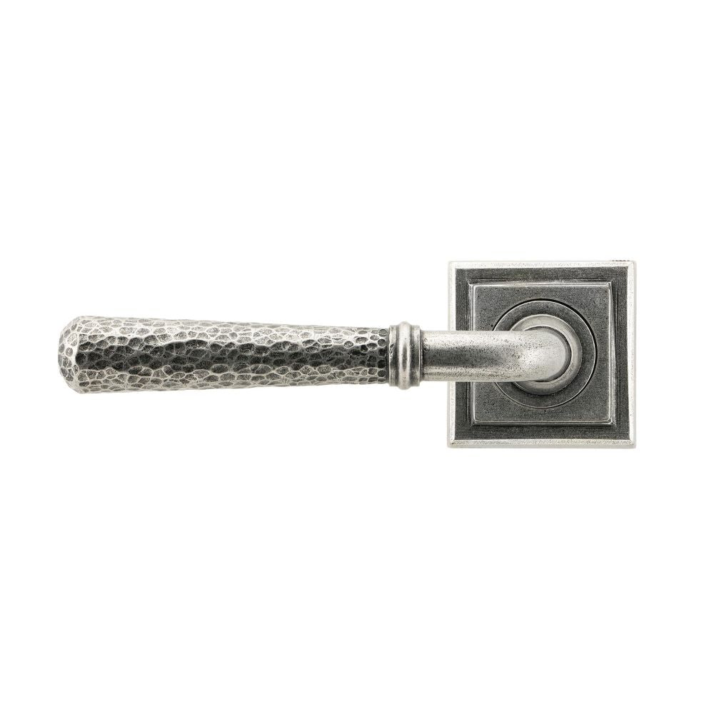 This is an image showing From The Anvil - Pewter Hammered Newbury Lever on Rose Set (Square) available from trade door handles, quick delivery and discounted prices