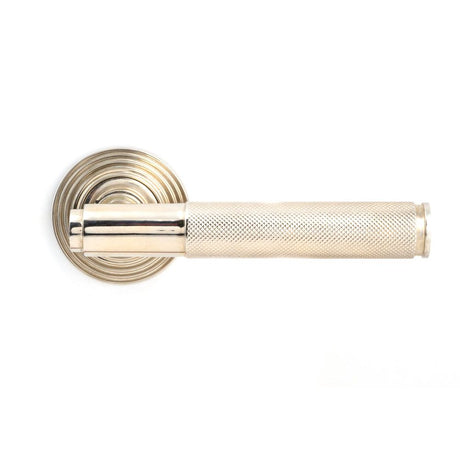 This is an image showing From The Anvil - Polished Nickel Brompton Lever on Rose Set (Beehive) available from trade door handles, quick delivery and discounted prices