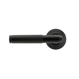 This is an image showing From The Anvil - Black Brompton Lever on Rose Set (Beehive) available from trade door handles, quick delivery and discounted prices