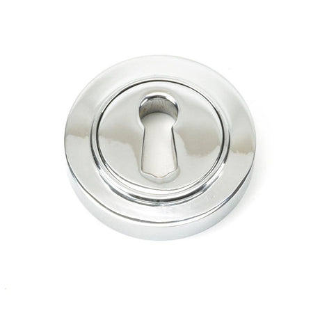 This is an image showing From The Anvil - Polished Chrome Round Escutcheon (Plain) available from trade door handles, quick delivery and discounted prices