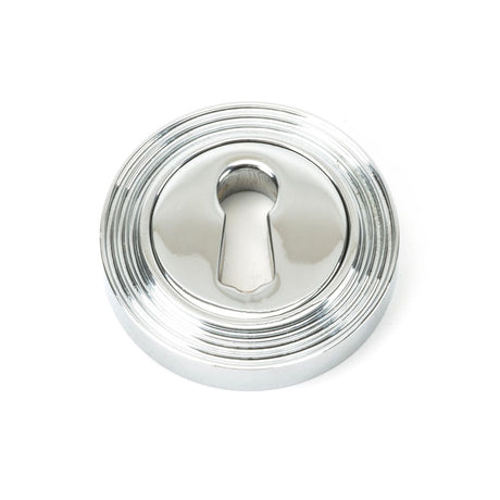 This is an image showing From The Anvil - Polished Chrome Round Escutcheon (Beehive) available from trade door handles, quick delivery and discounted prices