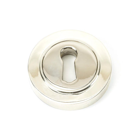 This is an image showing From The Anvil - Polished Nickel Round Escutcheon (Plain) available from trade door handles, quick delivery and discounted prices