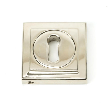 This is an image showing From The Anvil - Polished Nickel Round Escutcheon (Square) available from trade door handles, quick delivery and discounted prices