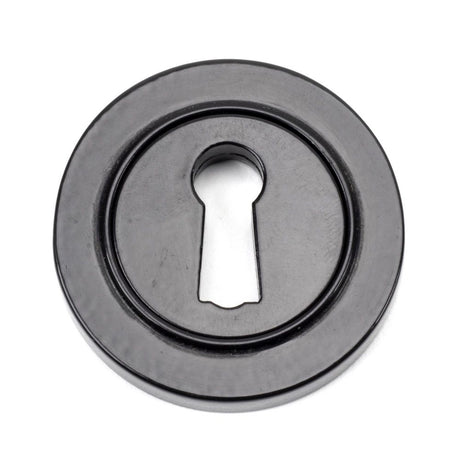 This is an image showing From The Anvil - Black Round Escutcheon (Plain) available from trade door handles, quick delivery and discounted prices