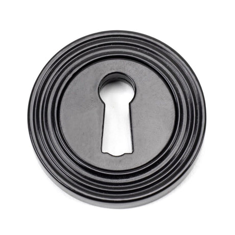 This is an image showing From The Anvil - Black Round Escutcheon (Beehive) available from trade door handles, quick delivery and discounted prices
