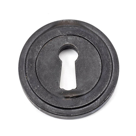 This is an image showing From The Anvil - External Beeswax Round Escutcheon (Art Deco) available from trade door handles, quick delivery and discounted prices