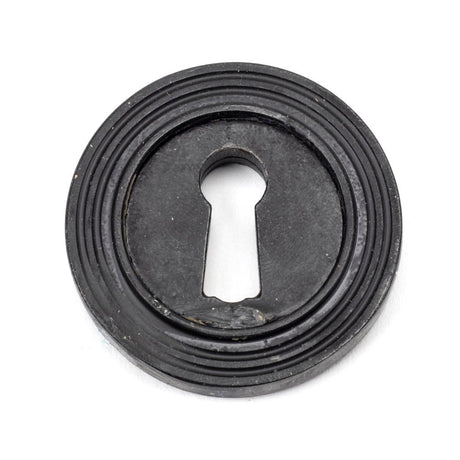 This is an image showing From The Anvil - External Beeswax Round Escutcheon (Beehive) available from trade door handles, quick delivery and discounted prices