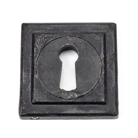 This is an image showing From The Anvil - External Beeswax Round Escutcheon (Square) available from trade door handles, quick delivery and discounted prices