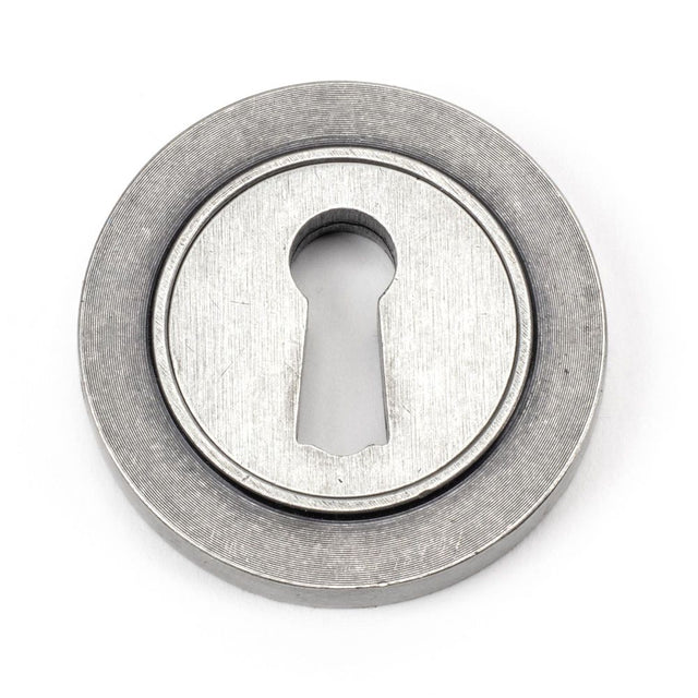 This is an image showing From The Anvil - Pewter Round Escutcheon (Plain) available from trade door handles, quick delivery and discounted prices