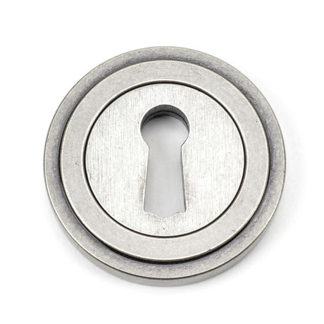 This is an image showing From The Anvil - Pewter Round Escutcheon (Art Deco) available from trade door handles, quick delivery and discounted prices