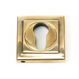 This is an image showing From The Anvil - Aged Brass Round Euro Escutcheon (Square) available from trade door handles, quick delivery and discounted prices