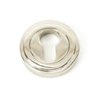 This is an image showing From The Anvil - Polished Nickel Round Euro Escutcheon (Art Deco) available from trade door handles, quick delivery and discounted prices