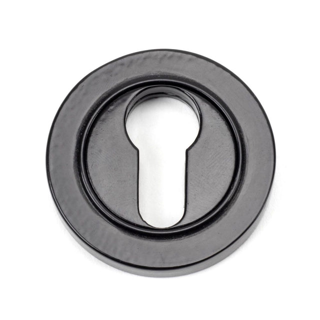 This is an image showing From The Anvil - Black Round Euro Escutcheon (Plain) available from trade door handles, quick delivery and discounted prices