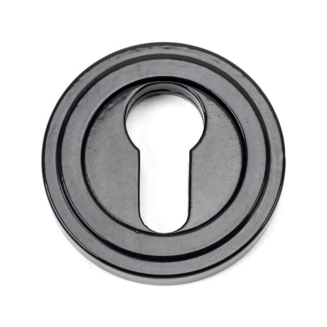 This is an image showing From The Anvil - Black Round Euro Escutcheon (Art Deco) available from trade door handles, quick delivery and discounted prices