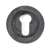 This is an image showing From The Anvil - External Beeswax Round Euro Escutcheon (Plain) available from trade door handles, quick delivery and discounted prices