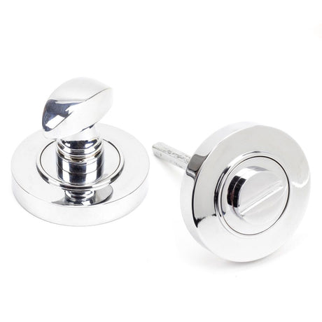 This is an image showing From The Anvil - Polished Chrome Round Thumbturn Set (Plain) available from trade door handles, quick delivery and discounted prices