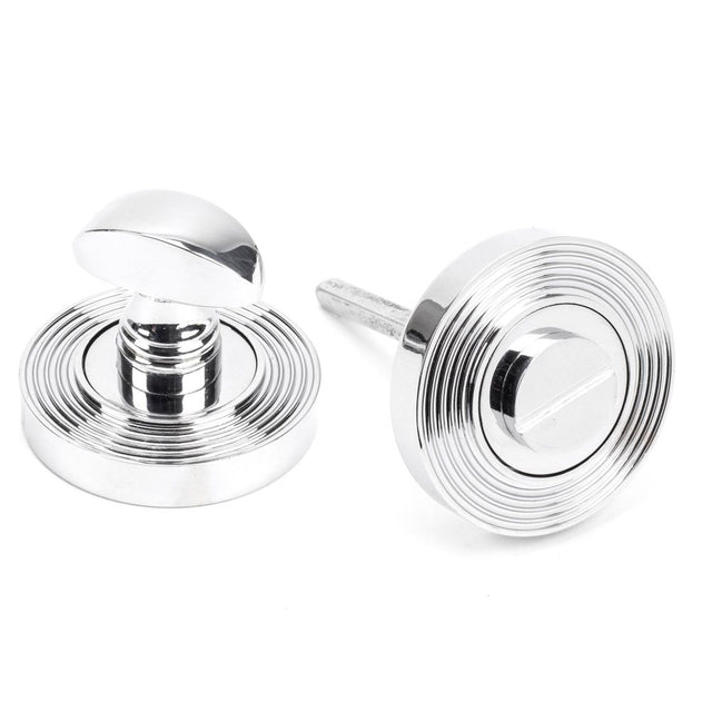 This is an image showing From The Anvil - Polished Chrome Round Thumbturn Set (Beehive) available from trade door handles, quick delivery and discounted prices