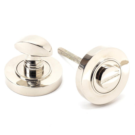 This is an image showing From The Anvil - Polished Nickel Round Thumbturn Set (Plain) available from trade door handles, quick delivery and discounted prices