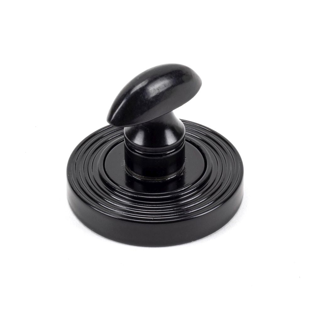 This is an image showing From The Anvil - Black Round Thumbturn Set (Beehive) available from trade door handles, quick delivery and discounted prices