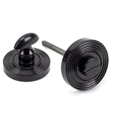 This is an image showing From The Anvil - Black Round Thumbturn Set (Beehive) available from trade door handles, quick delivery and discounted prices