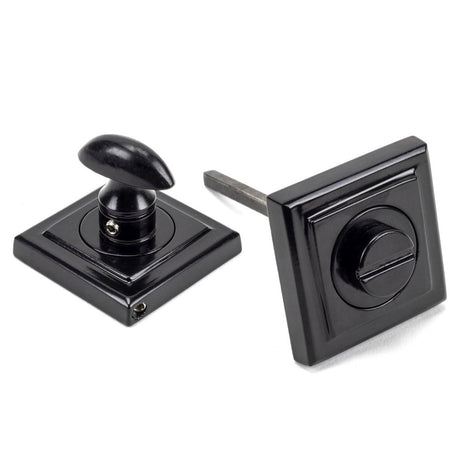 This is an image showing From The Anvil - Black Round Thumbturn Set (Square) available from trade door handles, quick delivery and discounted prices